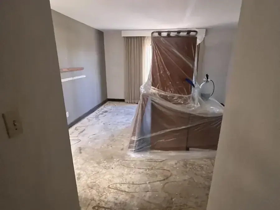 Plastic sheeting wrapped around furniture to protect it during a dry-out