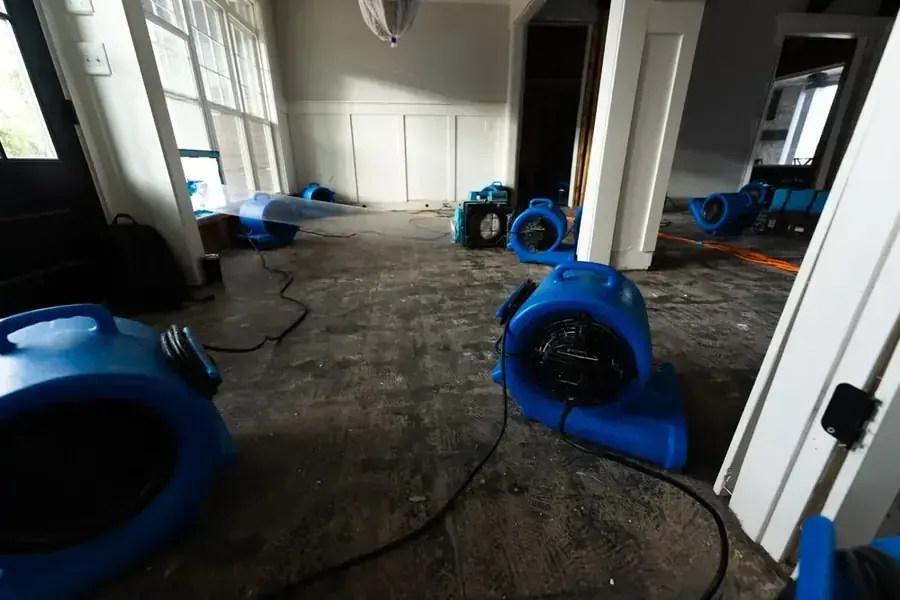 A torn-out subfloor drying after water extraction
