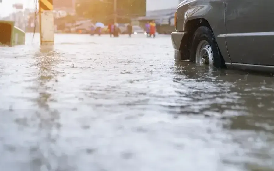 Floodwater spread across a street after a heavy storm